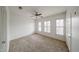 Bedroom with lots of natural light, carpeted floors, and an open layout at 14250 W Wigwam Blvd # 2822, Litchfield Park, AZ 85340