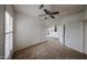 Vacant bedroom featuring carpeted floors and easy access to the kitchen at 14250 W Wigwam Blvd # 2822, Litchfield Park, AZ 85340