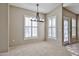 Cozy dining area with natural light streaming through shuttered windows at 14250 W Wigwam Blvd # 2822, Litchfield Park, AZ 85340