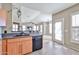 Modern kitchen with stainless steel appliances, granite countertops, and open view to living room at 14250 W Wigwam Blvd # 2822, Litchfield Park, AZ 85340