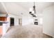 Expansive living area open to the kitchen, featuring carpet and a fireplace for comfortable living at 14250 W Wigwam Blvd # 2822, Litchfield Park, AZ 85340