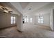 Spacious living area with natural light, ceiling fan, and neutral decor at 14250 W Wigwam Blvd # 2822, Litchfield Park, AZ 85340