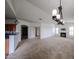 Open concept living area with modern lighting, fireplace, and easy access to kitchen at 14250 W Wigwam Blvd # 2822, Litchfield Park, AZ 85340