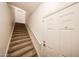 A carpeted stairway leads to an upper level, with a white door visible at 14250 W Wigwam Blvd # 2822, Litchfield Park, AZ 85340