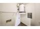 Utility room with tile flooring, water heater, and laundry hookups at 14250 W Wigwam Blvd # 2822, Litchfield Park, AZ 85340