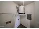 The utility room features a water heater, shelving, and electrical panel for convenience at 14250 W Wigwam Blvd # 2822, Litchfield Park, AZ 85340