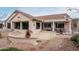 Large backyard patio with seating area and desert landscaping at 16019 W Kino Dr, Surprise, AZ 85374