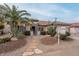 Single-story home with desert landscaping and a stone walkway at 16019 W Kino Dr, Surprise, AZ 85374