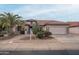 One-story house with a two-car garage and mature desert landscaping at 16019 W Kino Dr, Surprise, AZ 85374