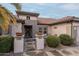 Front entry of a home with decorative pots and a metal gate at 16019 W Kino Dr, Surprise, AZ 85374