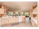 Open kitchen features a large island and views into the living room at 16019 W Kino Dr, Surprise, AZ 85374