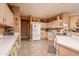 Bright kitchen with ample counter space and white appliances at 16019 W Kino Dr, Surprise, AZ 85374