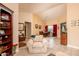 Bright living room with vaulted ceilings, tile floors, and comfy seating at 16019 W Kino Dr, Surprise, AZ 85374