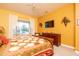 Main bedroom with king bed, dresser, and views of the backyard at 16019 W Kino Dr, Surprise, AZ 85374