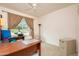 Home office with a large desk and plenty of room for work at 16019 W Kino Dr, Surprise, AZ 85374
