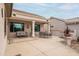 Relaxing patio seating area with built in BBQ and outdoor furniture at 16019 W Kino Dr, Surprise, AZ 85374