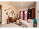 Cozy sitting area featuring a brown sofa and comfortable armchairs at 16019 W Kino Dr, Surprise, AZ 85374