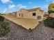 Large backyard with gravel and grass areas at 16187 W Port Royale Ln, Surprise, AZ 85379