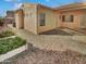 Landscaped backyard with gravel and raised garden beds at 16187 W Port Royale Ln, Surprise, AZ 85379