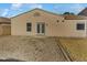 Home's backyard features a gravel and grass area at 16187 W Port Royale Ln, Surprise, AZ 85379