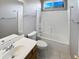 Clean bathroom with a shower/tub combo and updated vanity at 16187 W Port Royale Ln, Surprise, AZ 85379