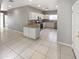 Open kitchen with island and stainless steel appliances at 16187 W Port Royale Ln, Surprise, AZ 85379