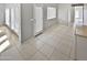 Bright kitchen features an island, stainless steel appliances, and ample cabinet space at 16187 W Port Royale Ln, Surprise, AZ 85379