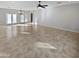 Large living area with tile flooring and lots of natural light at 16187 W Port Royale Ln, Surprise, AZ 85379