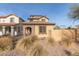 Two-story house with stone accents and landscaped front yard at 17855 N 114Th Dr, Surprise, AZ 85378