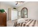 Bedroom with double closet and window shutters at 17906 W Agave Rd, Goodyear, AZ 85338