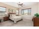 Bright bedroom with large windows and ceiling fan at 17906 W Agave Rd, Goodyear, AZ 85338