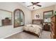 Bright bedroom with wood furniture and window shutters at 17906 W Agave Rd, Goodyear, AZ 85338