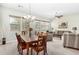 Elegant dining room with hardwood floors and large windows at 17906 W Agave Rd, Goodyear, AZ 85338