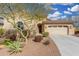 Single-story house with tan exterior and garage at 17906 W Agave Rd, Goodyear, AZ 85338