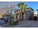 Charming two-story home with desert landscaping, stone accents, and a three-car garage at 17965 W Carol Ave, Waddell, AZ 85355