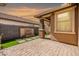 Beautiful backyard patio with stone pavers, a water feature, and lush landscaping at 18716 N Jameson Dr, Maricopa, AZ 85138
