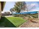 Wide shot of backyard mural, grass, rock at 18716 N Jameson Dr, Maricopa, AZ 85138