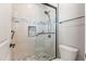 New bathroom boasts large glass enclosed shower with tiled walls and a shower bench at 18716 N Jameson Dr, Maricopa, AZ 85138