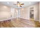 Spacious bedroom featuring wood floors and a walk-in closet at 18716 N Jameson Dr, Maricopa, AZ 85138