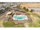 High angle shot of a refreshing community pool and lounge area, perfect for relaxation and socializing at 18716 N Jameson Dr, Maricopa, AZ 85138