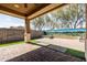 Charming covered patio showcasing a brick floor design and picturesque views of the mural at 18716 N Jameson Dr, Maricopa, AZ 85138
