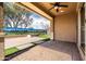 Inviting covered patio with ceiling fan, beautiful mural, and stone flooring creates the perfect outdoor living space at 18716 N Jameson Dr, Maricopa, AZ 85138