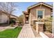 Welcoming front entrance with a brick-paved walkway and decorative landscaping at 18716 N Jameson Dr, Maricopa, AZ 85138