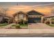 Charming single-story home featuring a two-car garage and desert landscaping at 18716 N Jameson Dr, Maricopa, AZ 85138
