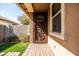 Cozy front porch featuring a decorative security door and a paved walkway at 18716 N Jameson Dr, Maricopa, AZ 85138