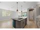 Open floor plan with an eat-in kitchen island, pantry and lots of natural light at 18716 N Jameson Dr, Maricopa, AZ 85138