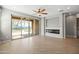 Open concept living room features modern fireplace, and sliding doors that open to the outside patio at 18716 N Jameson Dr, Maricopa, AZ 85138