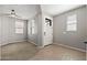 Bright living room with carpet and hardwood flooring, complemented by natural light at 18716 N Jameson Dr, Maricopa, AZ 85138