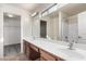 Bathroom with double vanity and large mirror at 18907 N Vemto St, Maricopa, AZ 85138