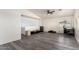 Bright bedroom featuring wood-look floors and a ceiling fan at 18907 N Vemto St, Maricopa, AZ 85138